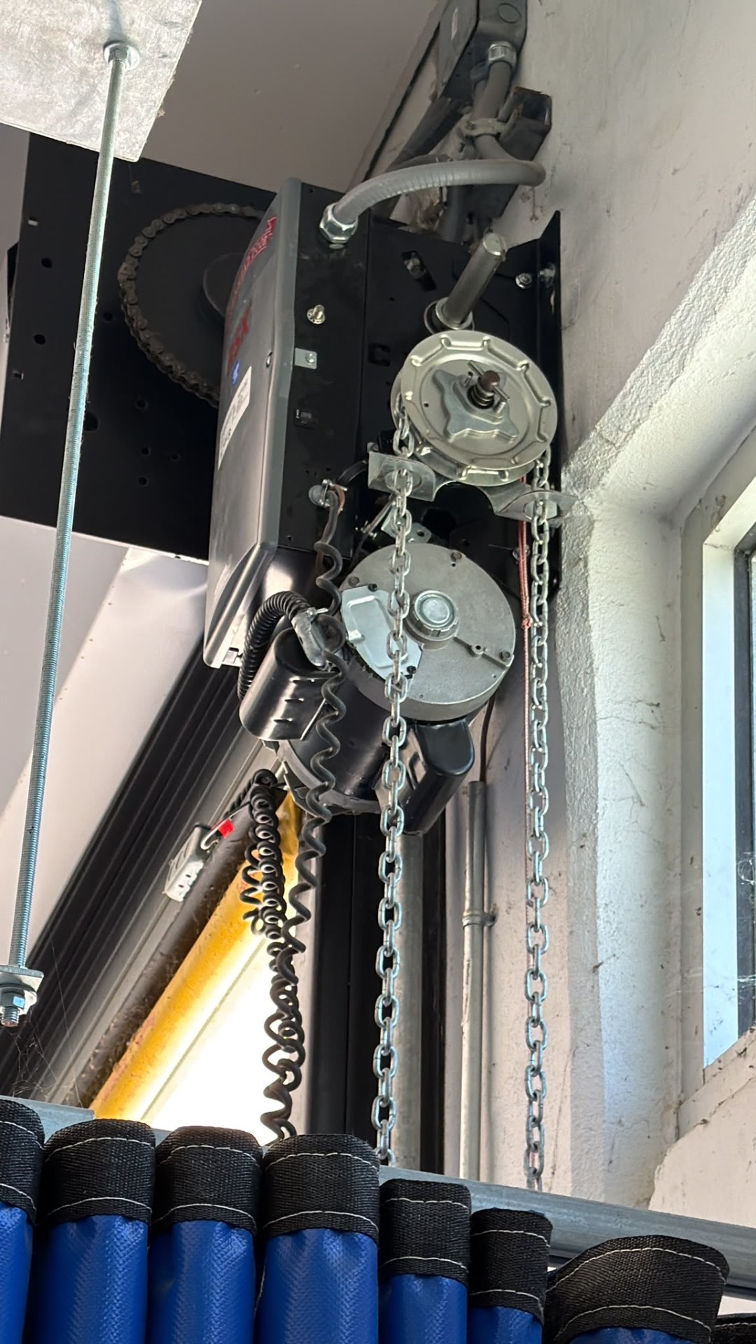 Commercial jackshaft garage door opener with chain hoist and torsion hardware